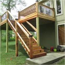 Elevated cedar deck with custom lattice railings and professional staircase installation by Pro Deck & Design in Kansas City, providing functional backyard access and expanded outdoor living space for Leavenworth County homes