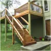 Elevated cedar deck with custom lattice railings and professional staircase installation by Pro Deck & Design in Kansas City, providing functional backyard access and expanded outdoor living space for Leavenworth County homes