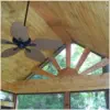 Custom vaulted cedar ceiling with panoramic windows in screened porch built by Pro Deck & Design in Kansas City, showcasing premium craftsmanship and natural light integration for year-round enjoyment in Wyandotte County homes