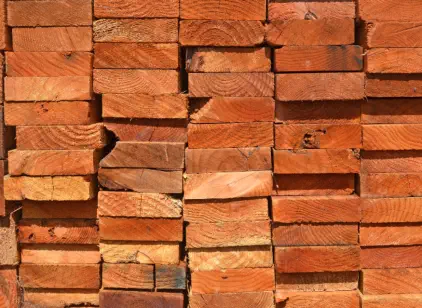 Premium western redwood lumber selected by Pro Deck & Design in Kansas City, showcasing rich natural colors and grain patterns used for custom deck and pergola construction throughout Wyandotte County homes
