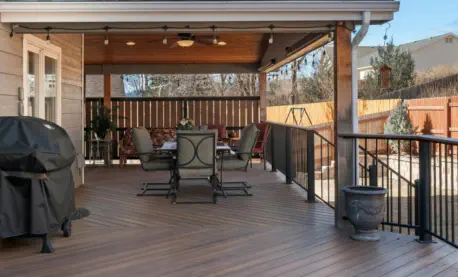 Custom-built covered deck in Kansas City featuring premium composite decking, professional installation, and complete outdoor living amenities for year-round enjoyment in Missouri weather