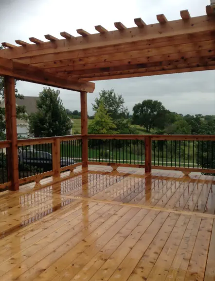 Custom cedar deck and pergola installation in Kansas City featuring premium natural wood construction, quality craftsmanship, and weather-resistant design perfect for Missouri's changing seasons and outdoor entertainment needs