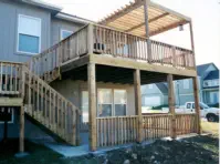 Professional multi-level deck construction in Kansas City with custom pergola, featuring expert installation, quality cedar materials, and specialized elevated design perfect for Kansas homes with walkout basements