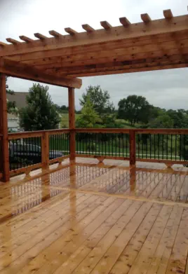 Custom cedar deck and pergola installation in Kansas City featuring premium natural wood construction, quality craftsmanship, and weather-resistant design perfect for Missouri's changing seasons and outdoor entertainment needs