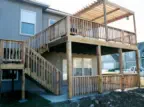 Professional multi-level deck construction in Kansas City with custom pergola, featuring expert installation, quality cedar materials, and specialized elevated design perfect for Kansas homes with walkout basements