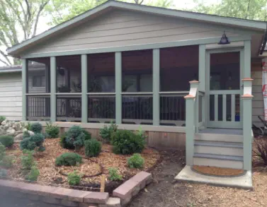 Custom screened porch addition in Kansas City featuring professional construction, quality materials, and seamless home integration by experienced Kansas contractors specializing in three-season outdoor living spaces