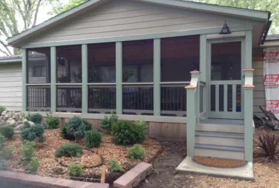 Custom screened porch addition in Kansas City featuring professional construction, quality materials, and seamless home integration by experienced Kansas contractors specializing in three-season outdoor living spaces