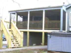 Custom two-level deck and screened porch in Leavenworth County Kansas featuring professional installation, space-maximizing design, and quality construction by experienced Kansas contractors specializing in innovative outdoor living solutions